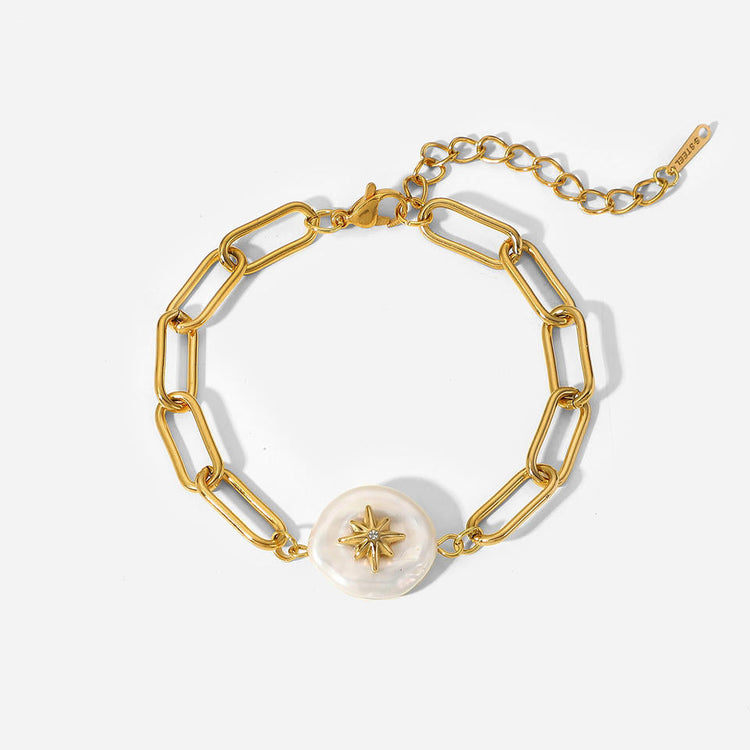 Moderne schakelarmband van stainless steel met goudverguld.