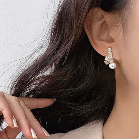 Boucles d'oreilles avec perle – Uniques et élégantes | Twinolo