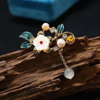 🌸 Bloemenbroche met Parel en Hangend Detail – Elegante Broche | Twinolo